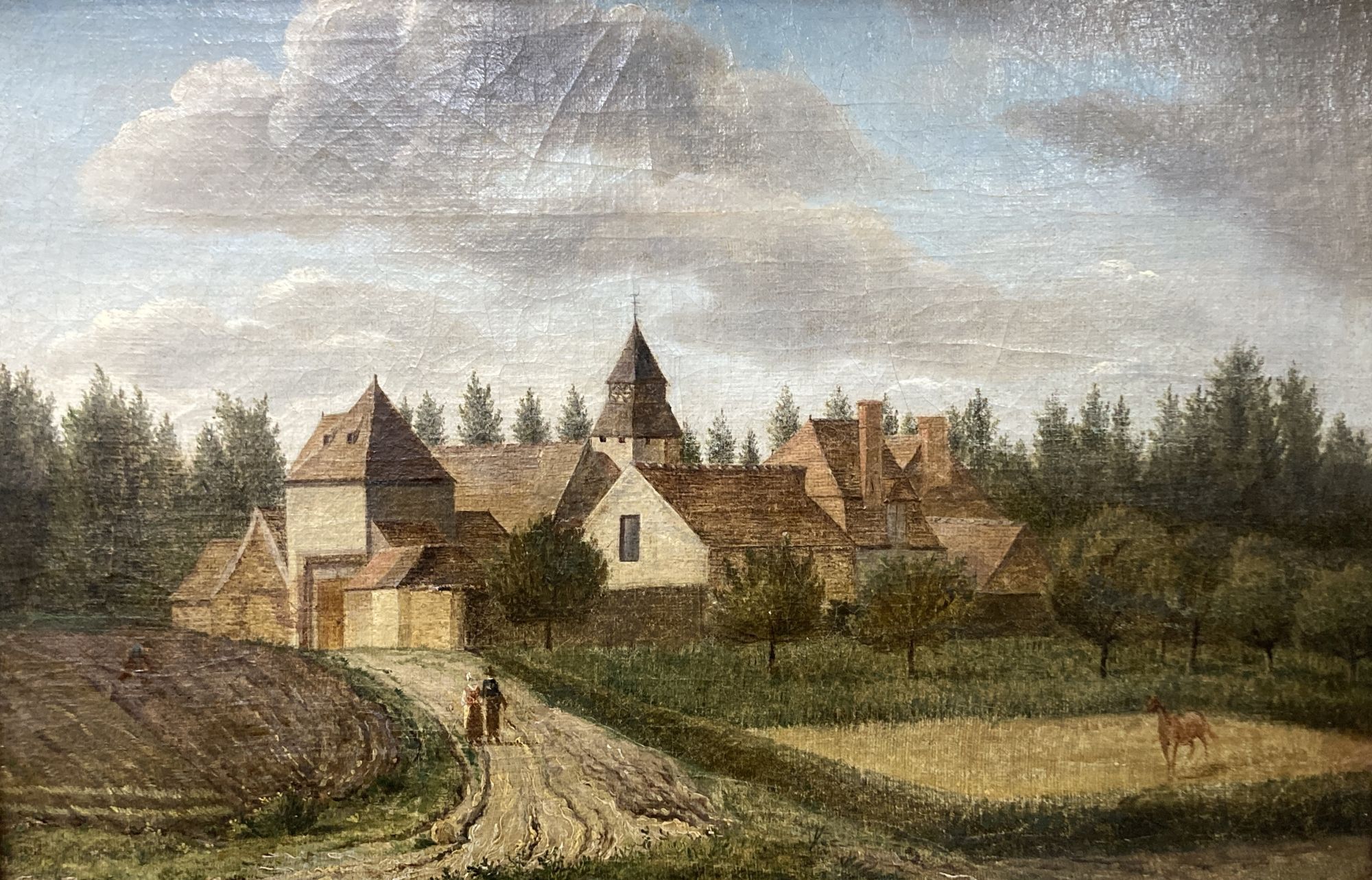 19th century Continental School, oil on canvas, View of a village with figures and a horse in the foreground, 29 x 45cm